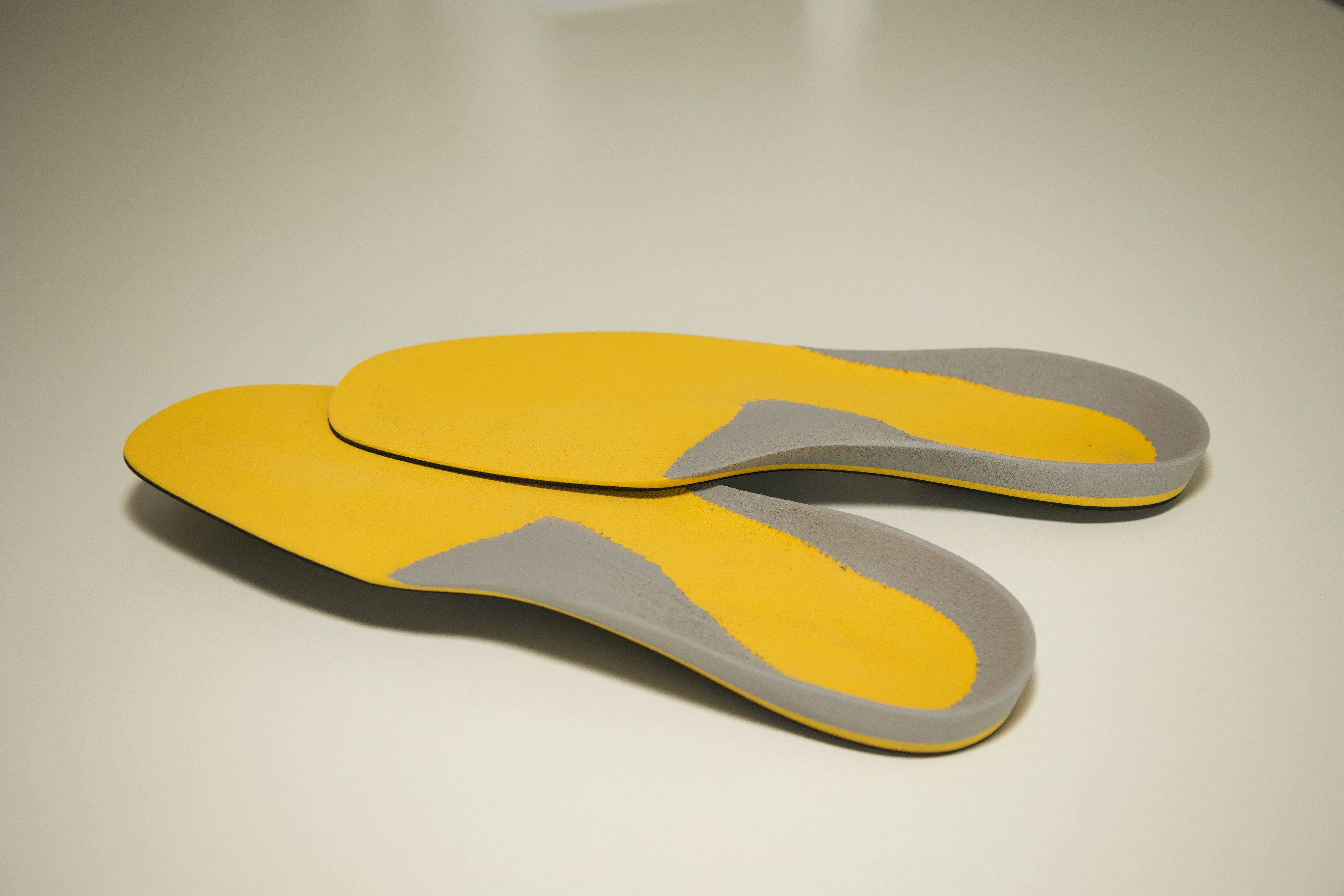 Pair of supportive shoe orthotics