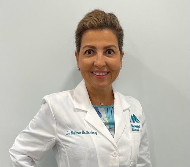 Dr. Fabienne Rottenberg in a white medical coat
