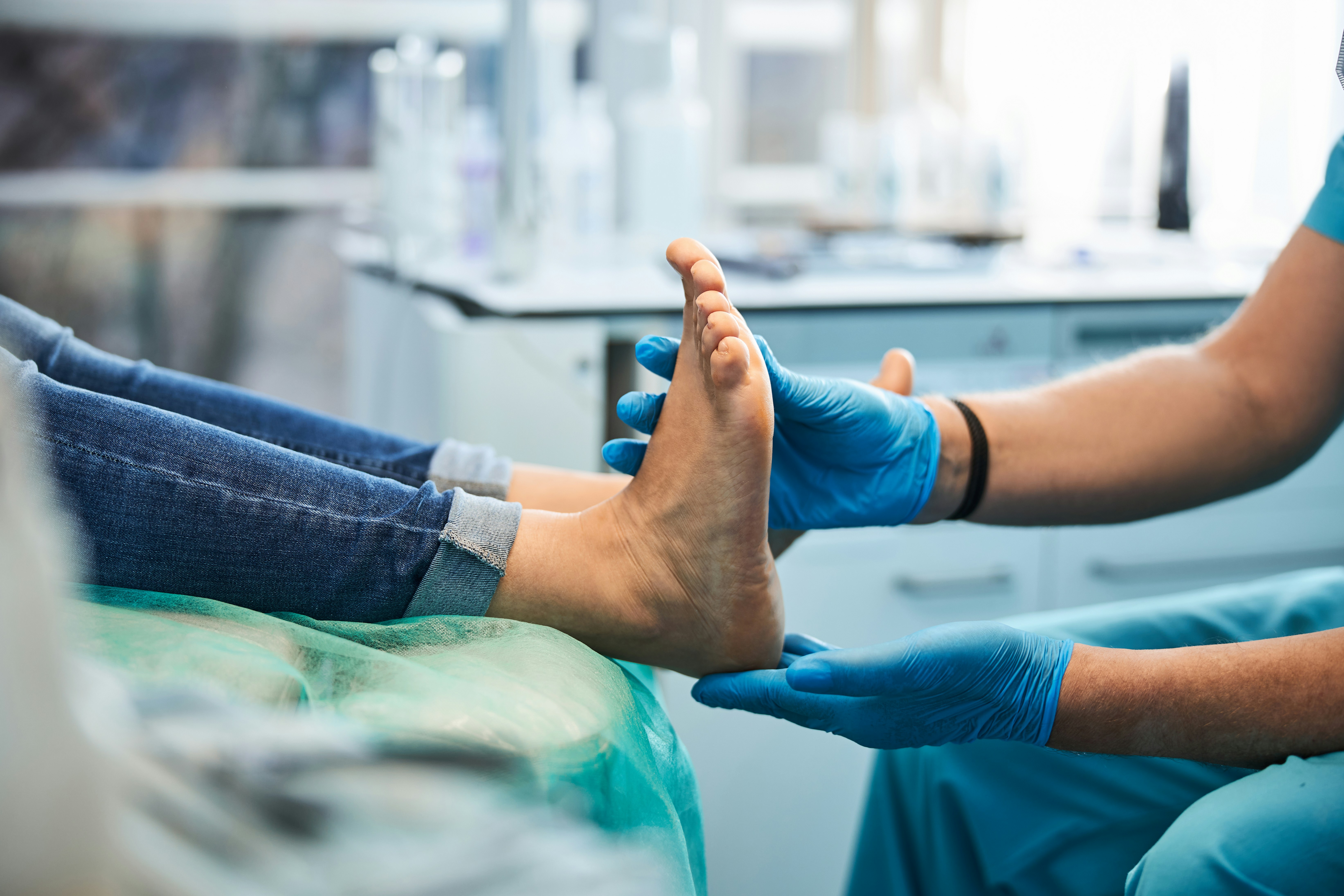 Clinician examining a patient's foot and ankle