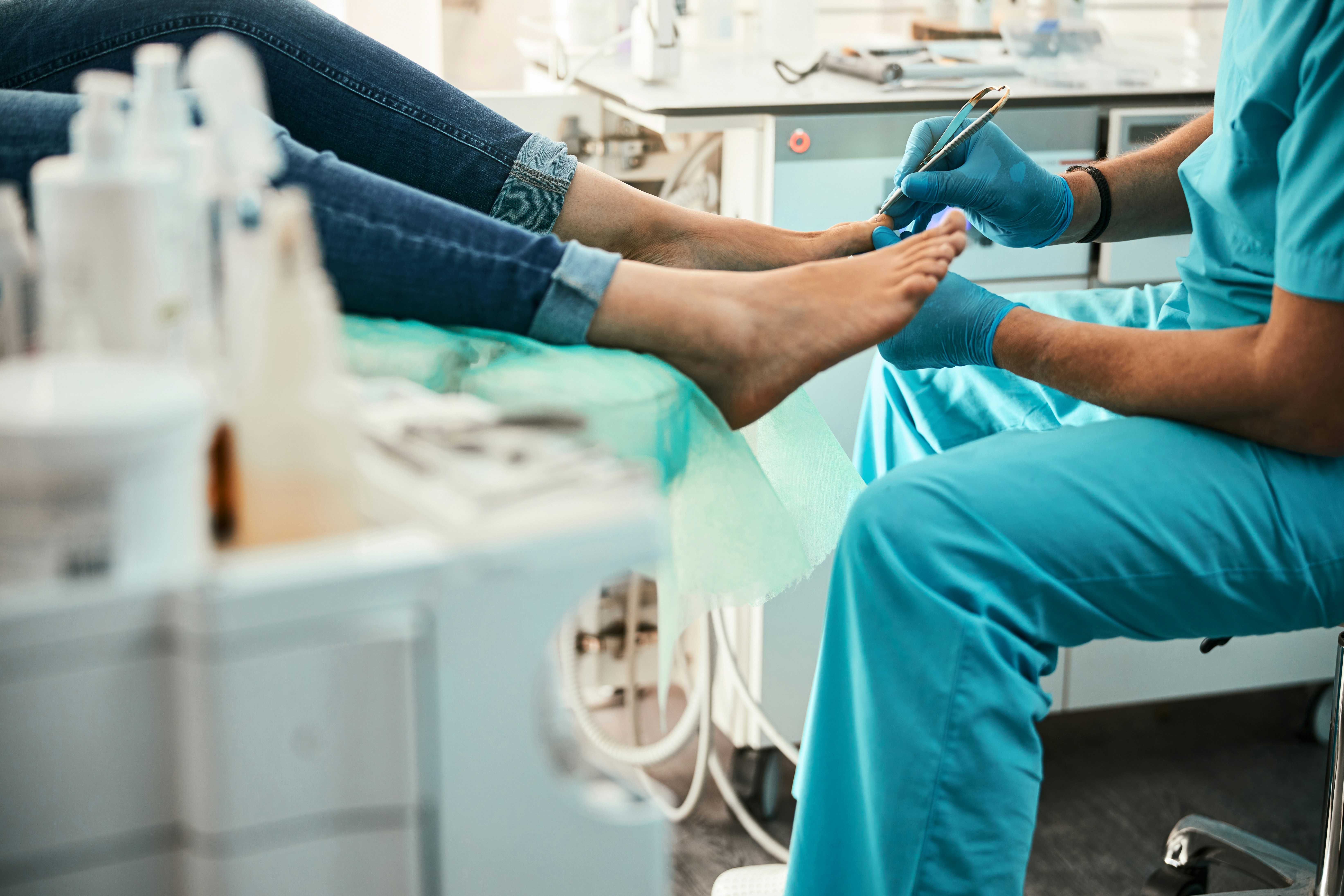 Clinician examining a patient's foot